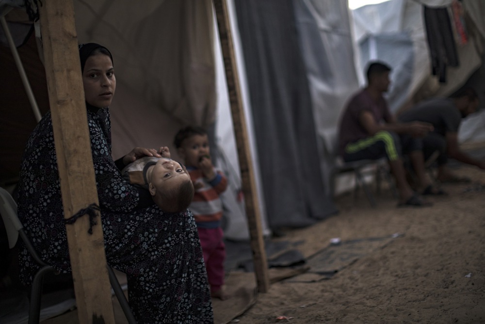 Internally displaced Palestinians at makeshift camp in Khan Younis
