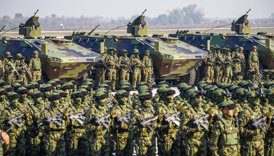 Serbian Army soldiers perform during a military parade