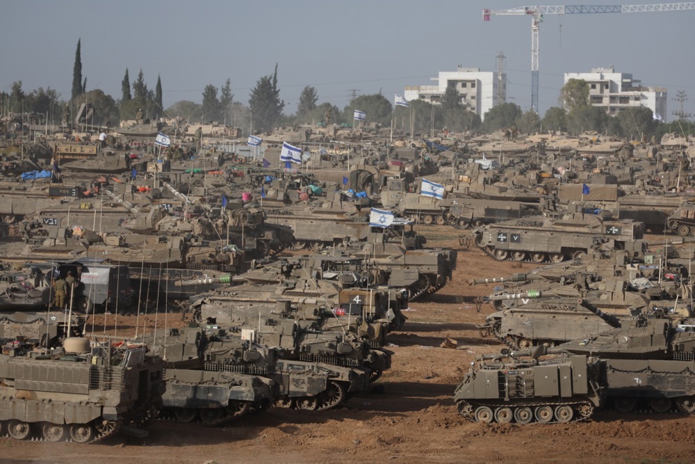 Israeli troops gather near the Gaza border, southern Israel