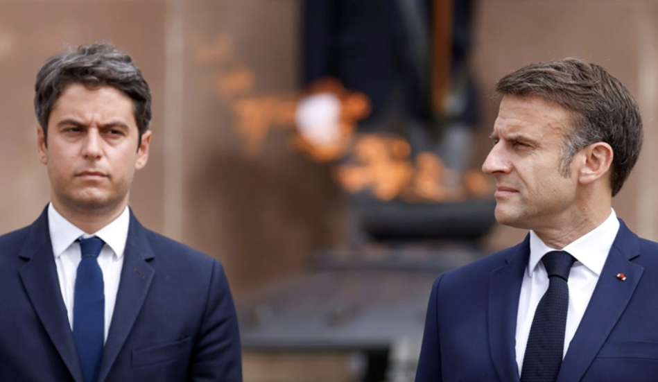 French President Emmanuel Macron (R) and France's Prime Minister Gabriel Attal (L) attend a ceremony marking the 84th anniversary