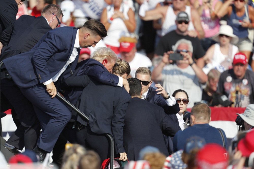 Former US President Donald Trump rushed off stage after incident at campaign rally