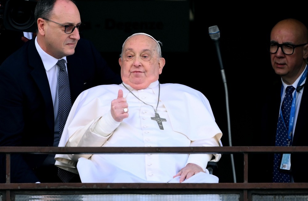 Pope Francis blesses the faithful from the balcony of the Gemelli hospital