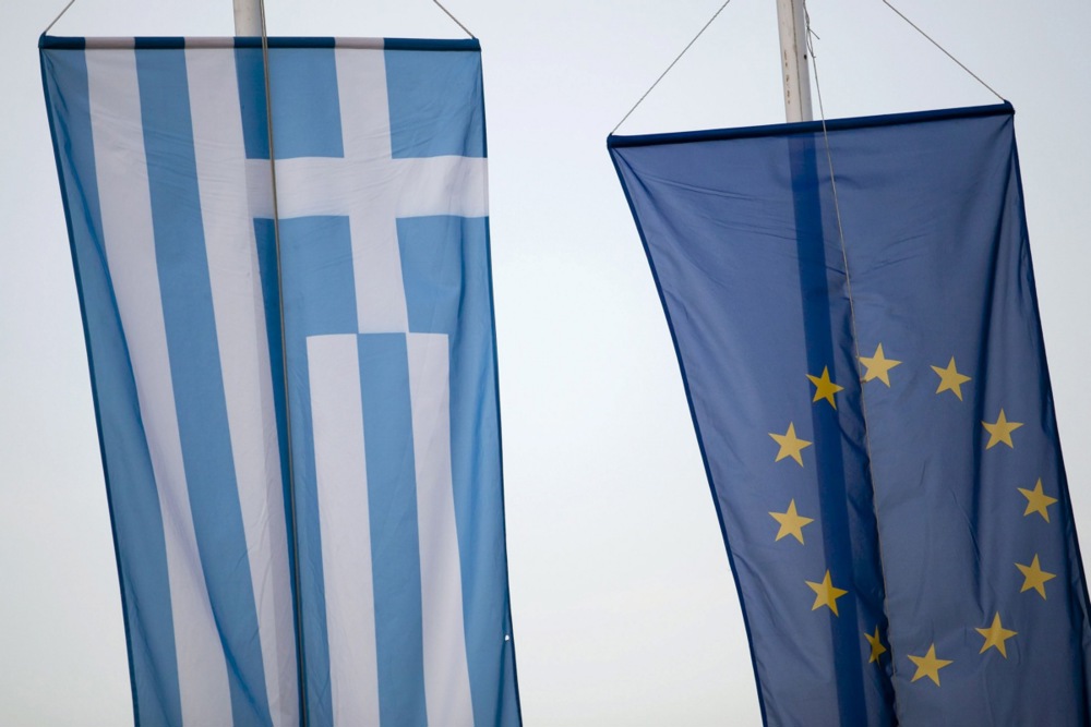 Flags of Greece and the EU in an ethnic Greek village in Hungary