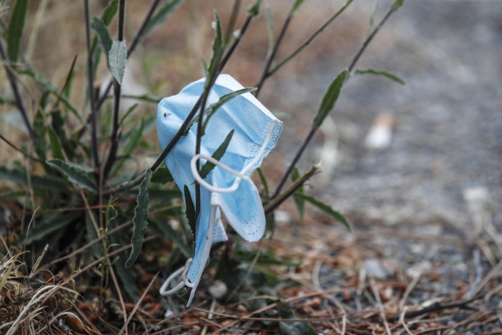 Discarded latex gloves and protective face masks