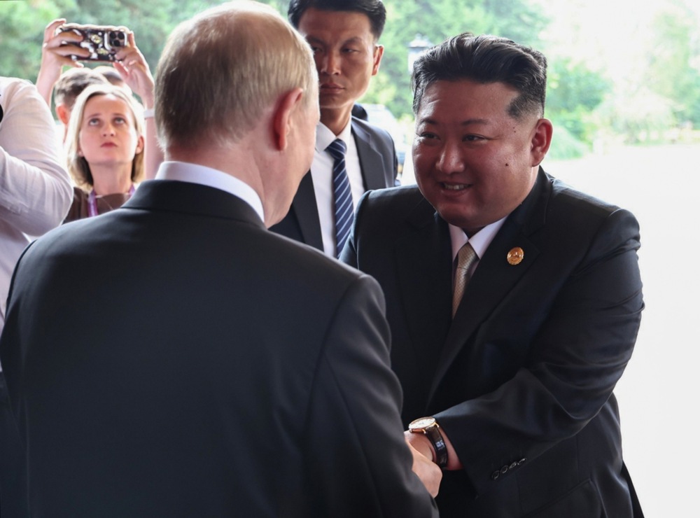 Russian President Vladimir Putin and North Korean leader Kim Jong Un meet in Beijing