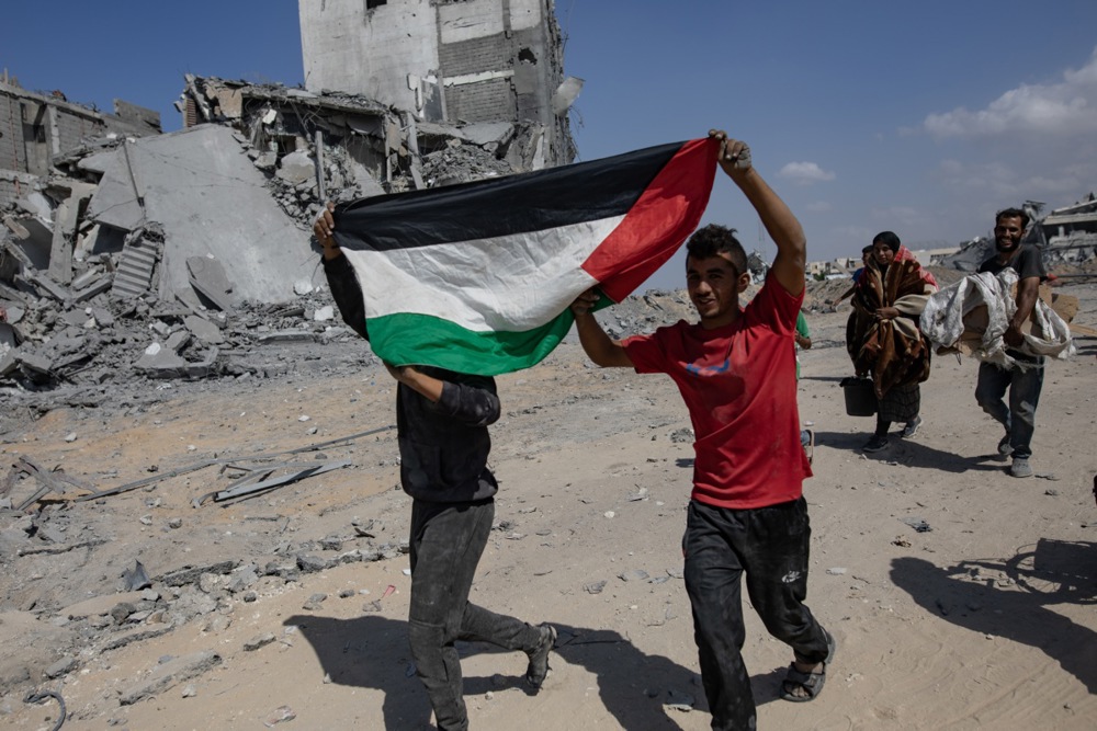 Palestinians inspect their destroyed homes in Khan Yunis