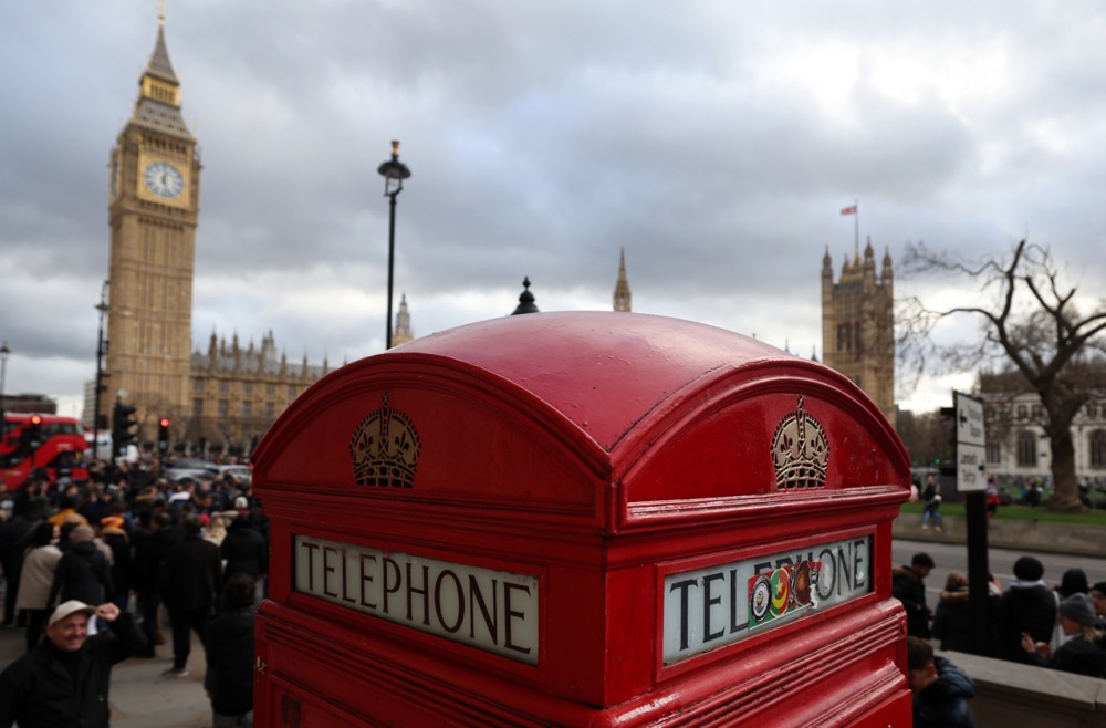 London's tourists flock to Westminsters' red phone boxes