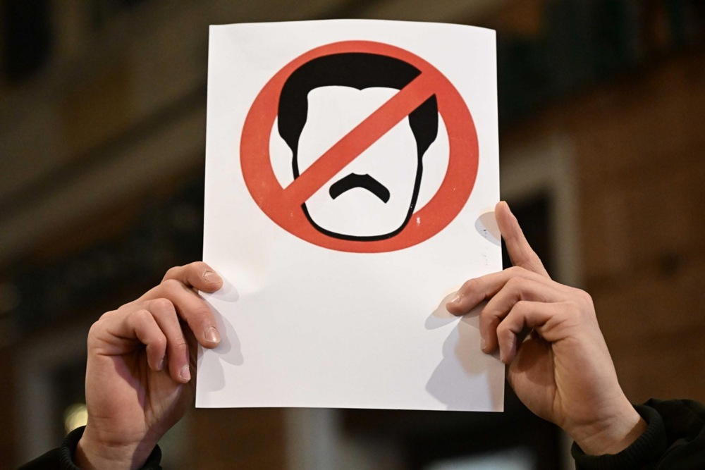 Anti-Maduro protesters take part in a rally following the US actions in Venezuela