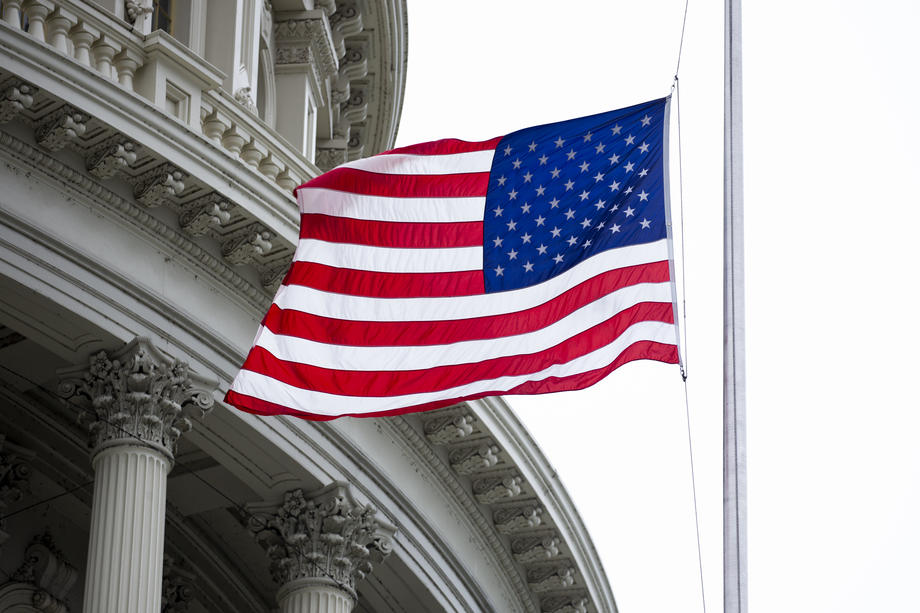 US flags fly at half-staff to mourn victims of COVID-19